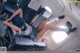 A woman laying on a chair in an airplane.